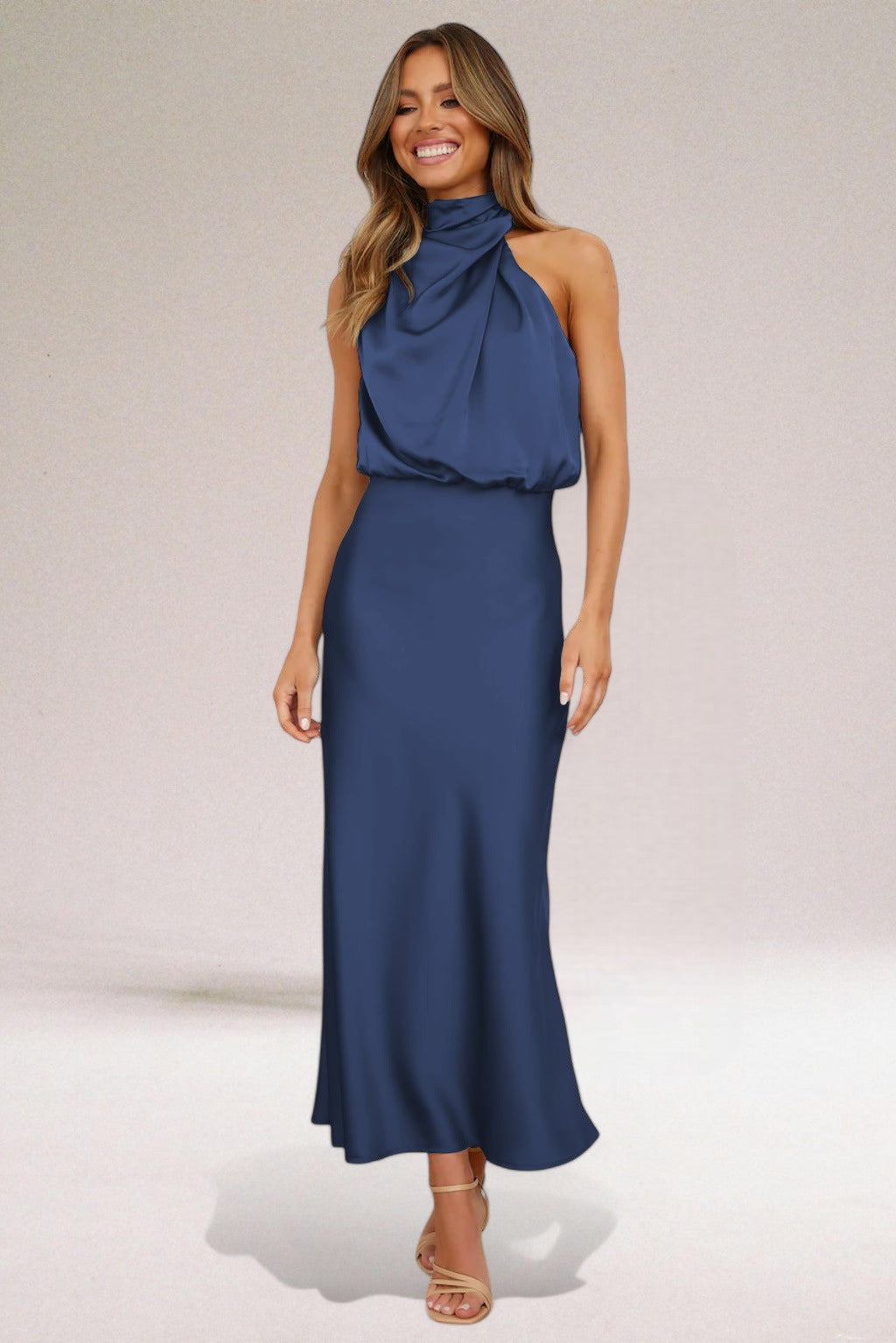 Elegant black halter neck dress with sleek silhouette and radiant finish for special occasions