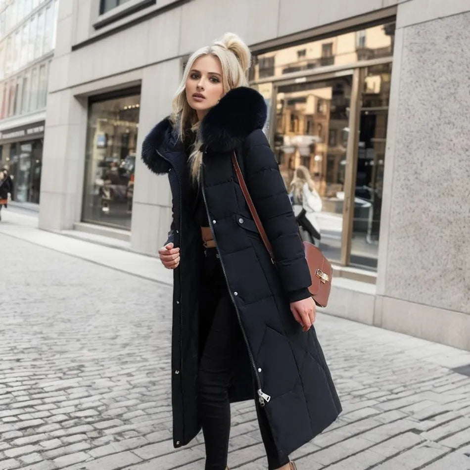 Women's long quilted winter coat with hood trim, flattering silhouette, cozy warmth in stylish design
