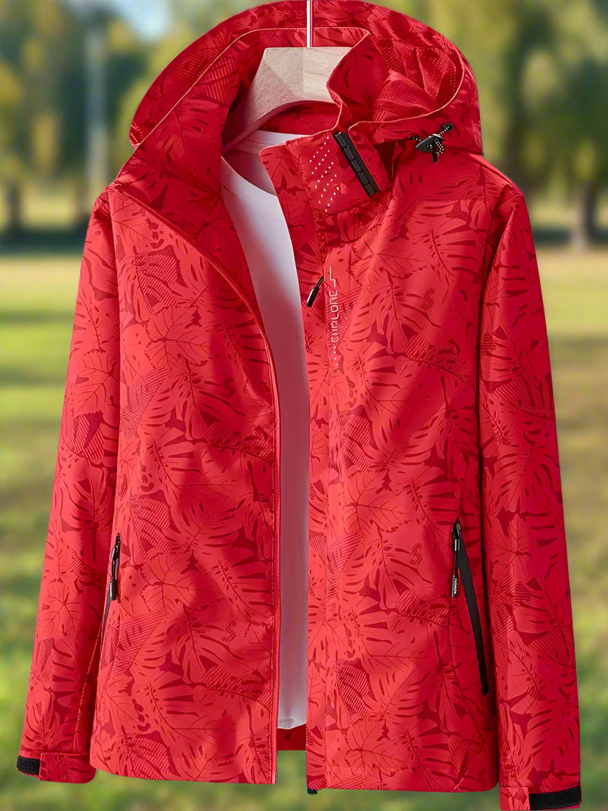 Women's lightweight waterproof summer jacket in bold leaf pattern with adjustable fit