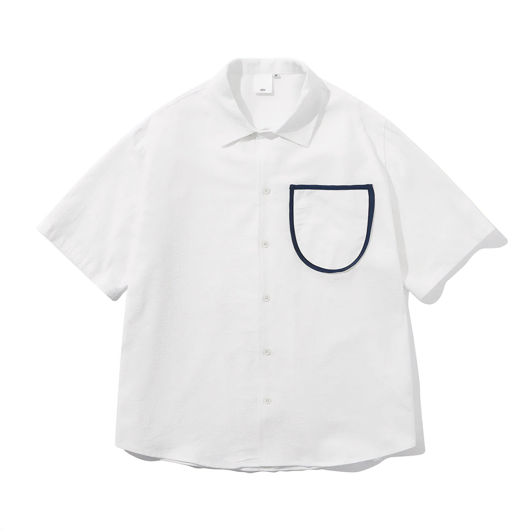 Loose-fit white camp collar shirt with contrast pocket detail, breathable cotton, button closure
