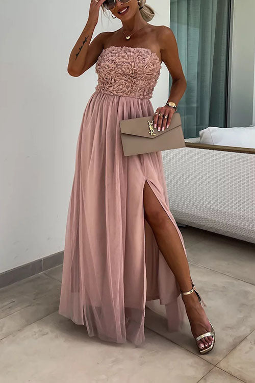 Women's strapless maxi dress with textured bodice, high slit, and flowy elegant silhouette for formal occasions