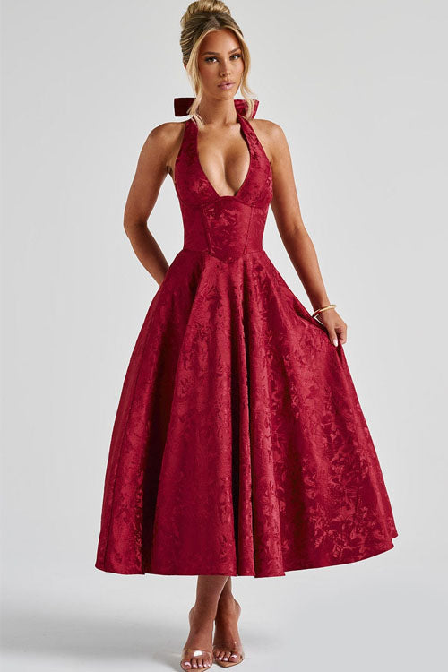 Floral jacquard maxi dress with V-neck halterneck, cinched waist, and flared skirt for special occasions