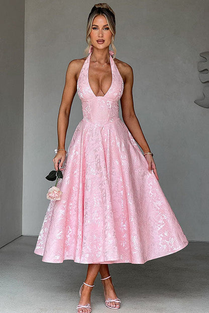 Floral jacquard maxi dress with V-neck halterneck, cinched waist, and flared skirt for celebrations