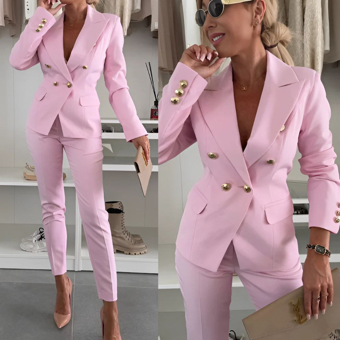 Ivory double-breasted suit set with notched lapels, tailored trousers, and metallic button accents