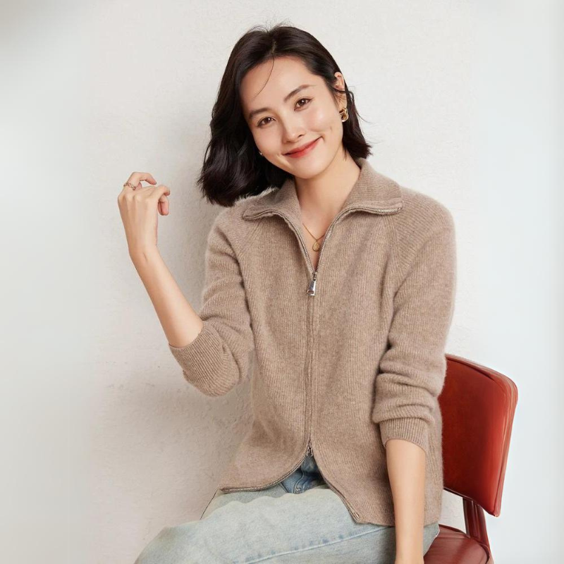 Merino wool zip-up sweater with turn-down collar, sleek zipper closure, timeless knit texture