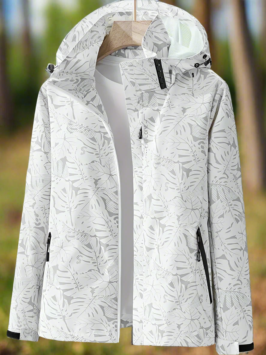 Women's lightweight waterproof summer jacket in bold leaf pattern with adjustable fit
