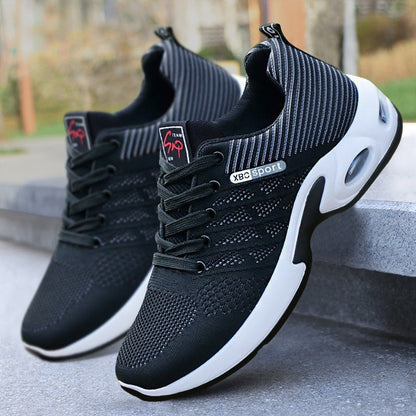 White comfort sneakers with breathable mesh upper and cushioned sole for all-day comfort