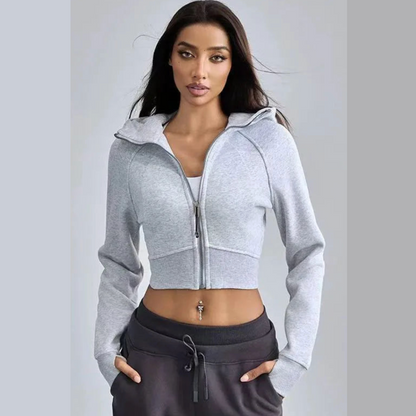 ZenCore cropped zip-up hoodie in neutral tone, sculpted body-hugging fit with high-neck closure