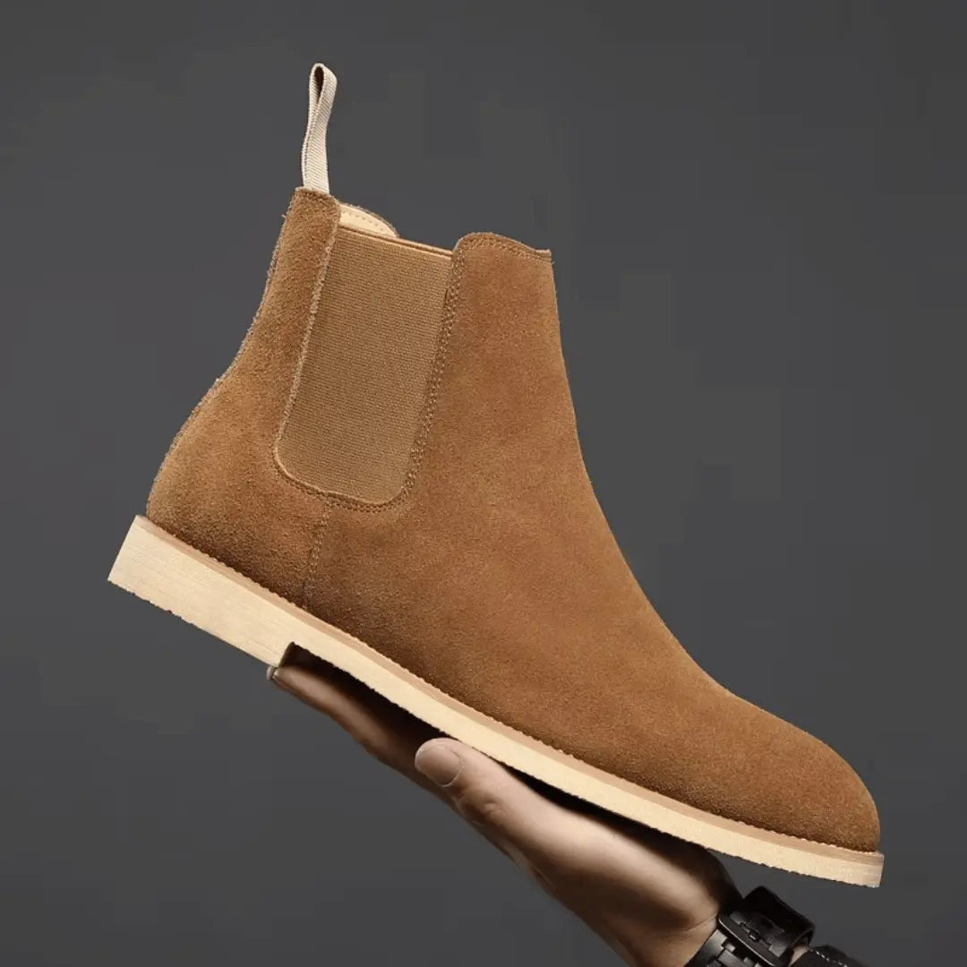 Olive green suede Chelsea boots with elastic side panels and sleek pull-tab detail