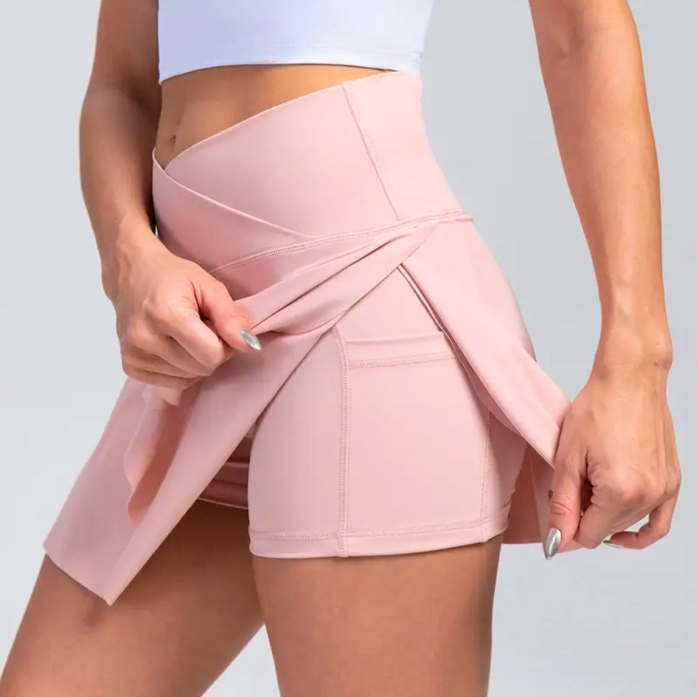 Tavro high-waist flared mini skirt with built-in shorts, front slits, and side pockets in stretchy fabric
