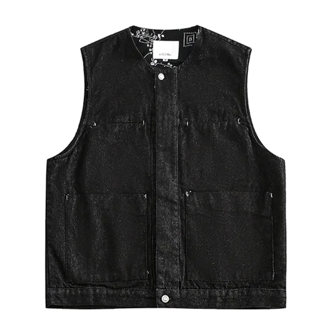 Blue denim tooling vest with riveted pockets, structured regular fit, and refined interior detailing