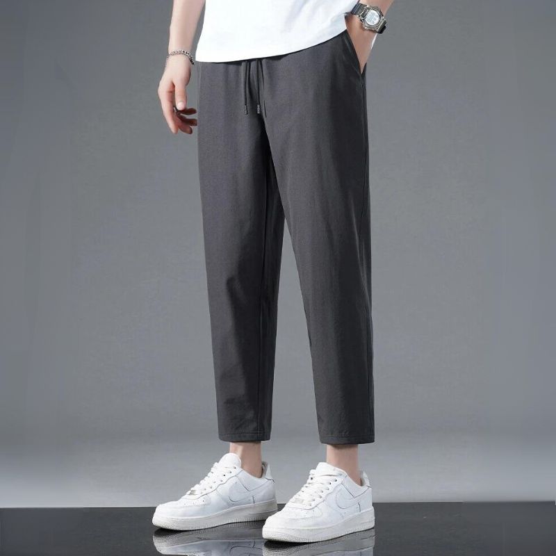 Black athletic stretch pants with second-skin fit, moisture-wicking and lightweight for active wear