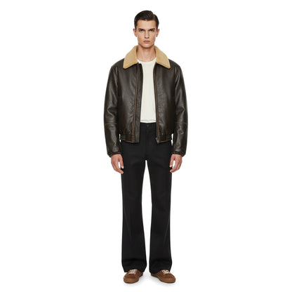 Black vegan leather faux shearling jacket with fade effect chest detail, relaxed fit waist-length silhouette