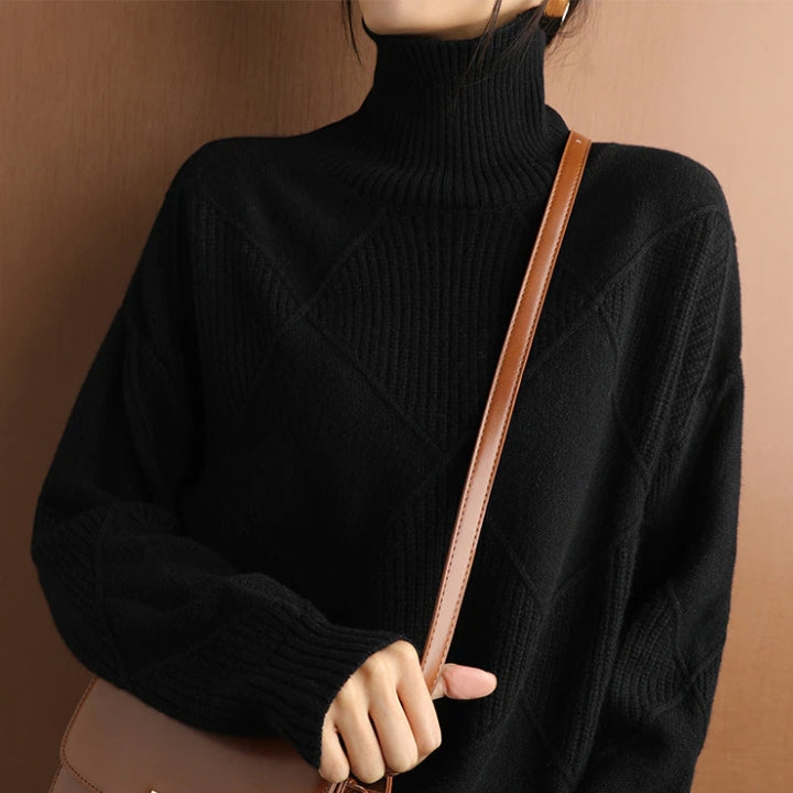 Cream diamond knit turtleneck sweater with ribbed neckline and textured pattern