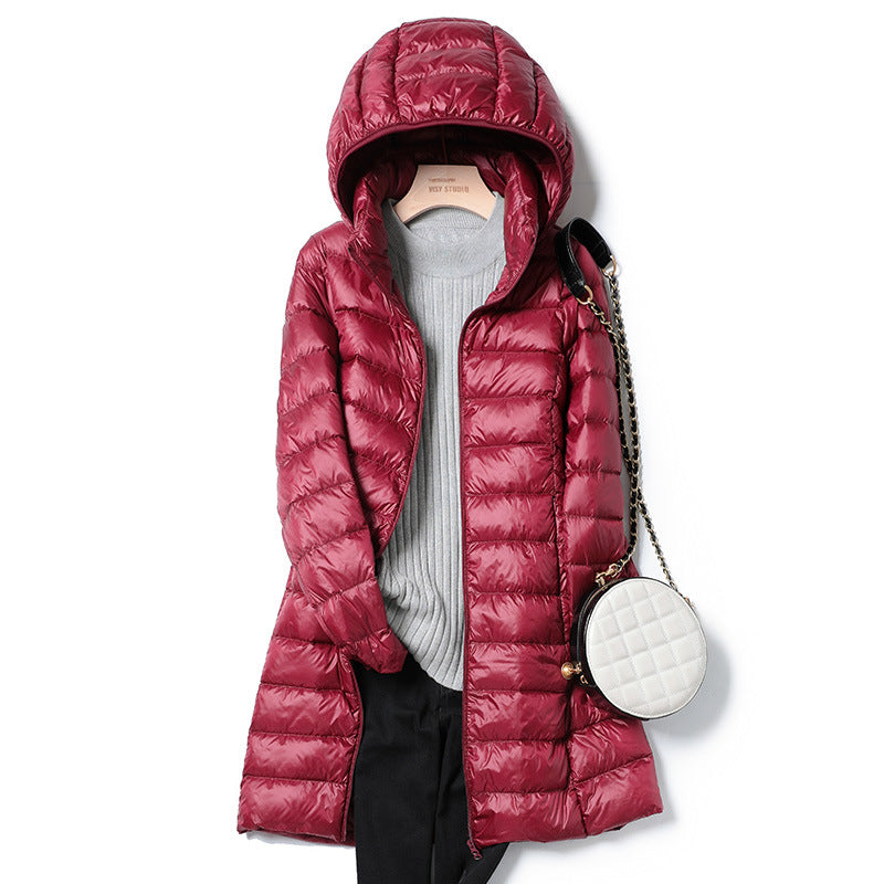 Medium length lightweight thin down jacket in neutral tone, sleek minimalist silhouette with subtle quilted stitching