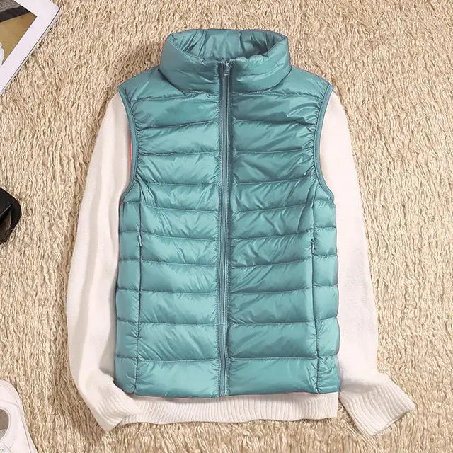 Women's quilted down vest lightweight insulated high collar zipper closure everyday warmth