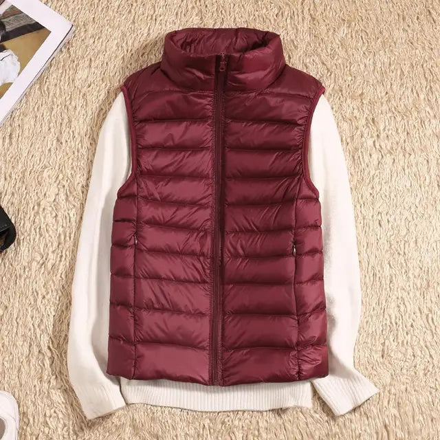 Women's lightweight quilted down vest with high collar, insulated slim fit for everyday warmth