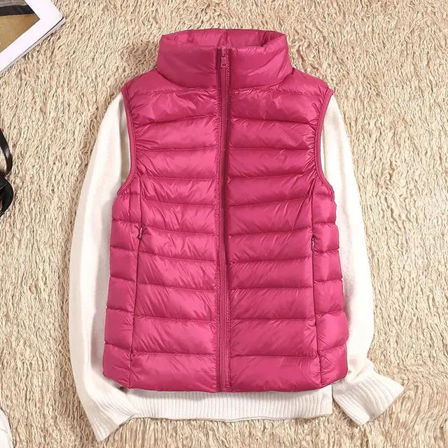 Women's quilted down vest lightweight insulated high collar zipper closure versatile layering piece