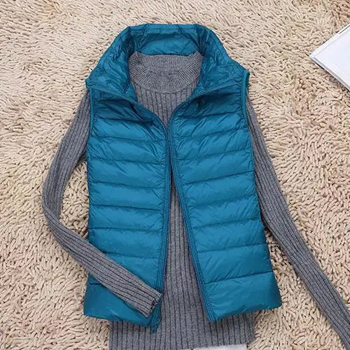 Women's lightweight quilted down vest with high collar, sleeveless insulated design for everyday warmth