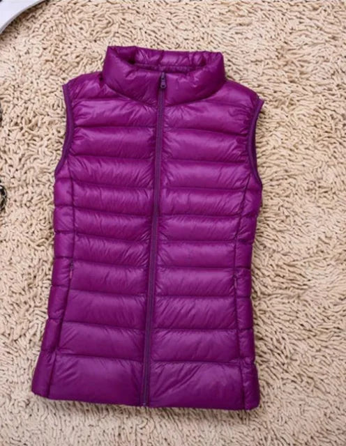 Women's quilted down vest lightweight insulated high collar zipper closure versatile layering piece