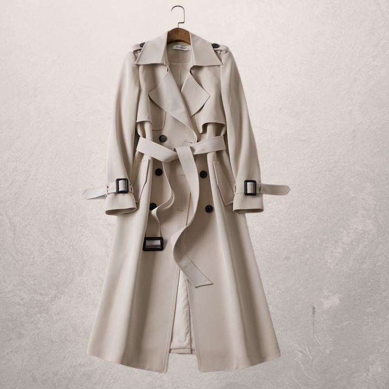 Elegant double-breasted trench coat with adjustable belt, cross-front closure, and cozy lining