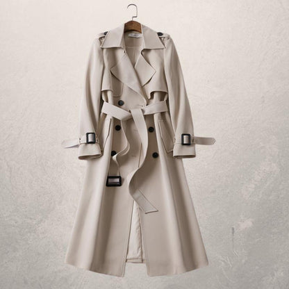 Elegant double-breasted trench coat with adjustable belt, cross-front closure, and cozy lining