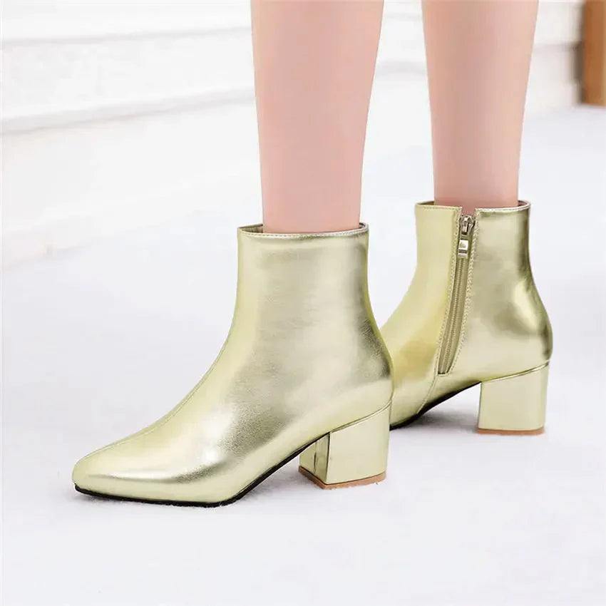 Women's metallic silver zip-up ankle boots with insulated lining for cold weather style