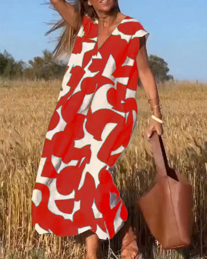 Women's flowy maxi dress with lace detailing and bold abstract print in a fluid silhouette