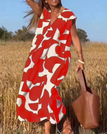 Women's flowy maxi dress with lace detailing and bold abstract print in a fluid silhouette