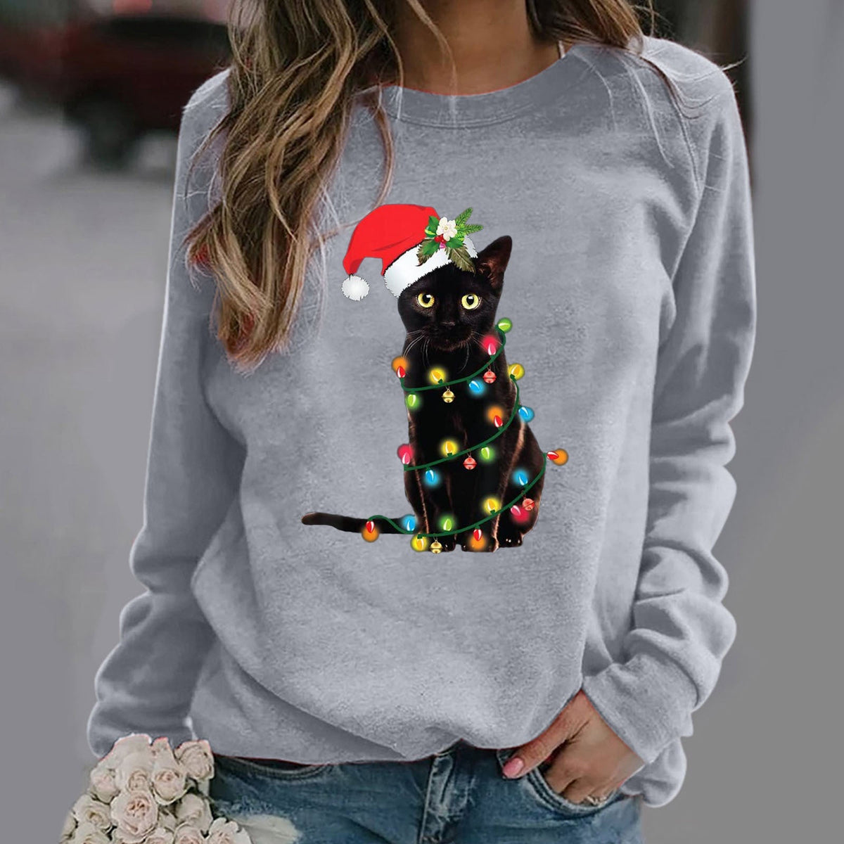 Women's gray relaxed fit crewneck sweatshirt with festive Christmas cat graphic print