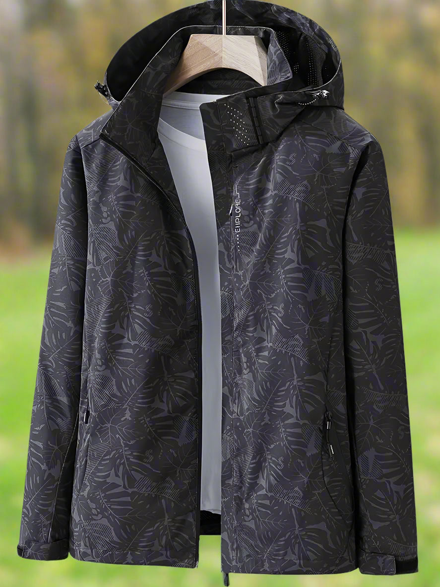 Women's lightweight waterproof summer jacket in bold leaf pattern with adjustable fit