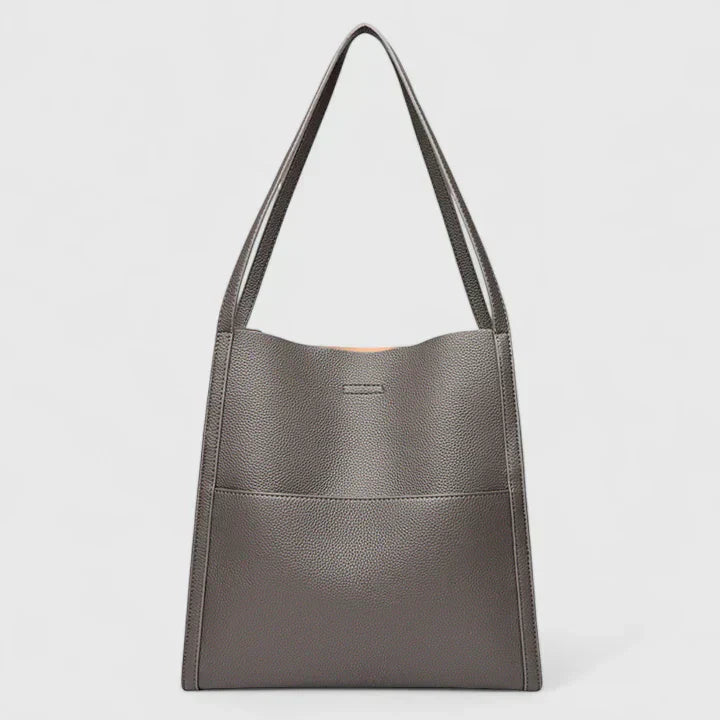 Structured handbag in neutral tones with clean lines, spacious interior, and minimalist elegant design