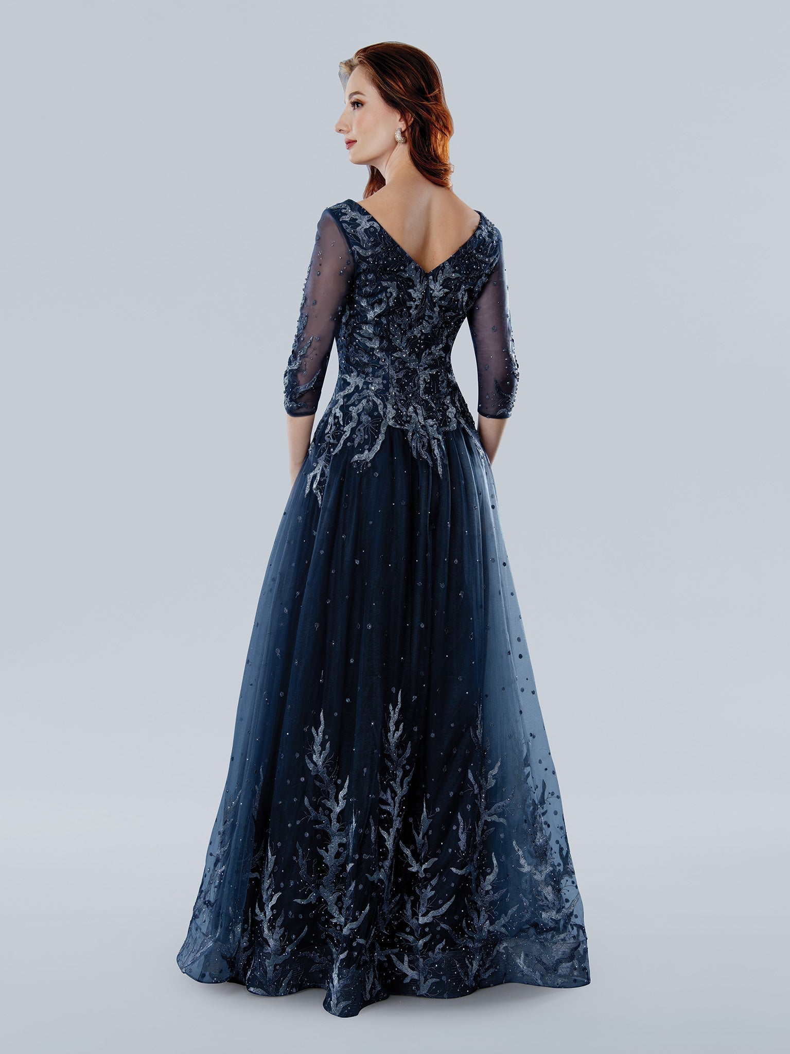 Stella Couture floral beaded tulle A-line formal gown with V-neckline and sheer three-quarter sleeves