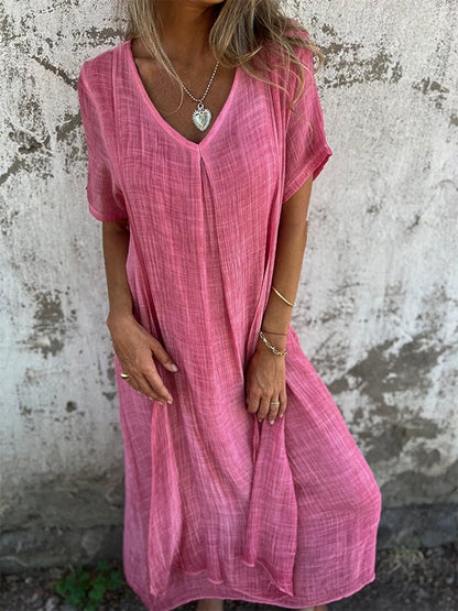 Garnet red flowy draped maxi dress with elongating silhouette for cocktail occasions