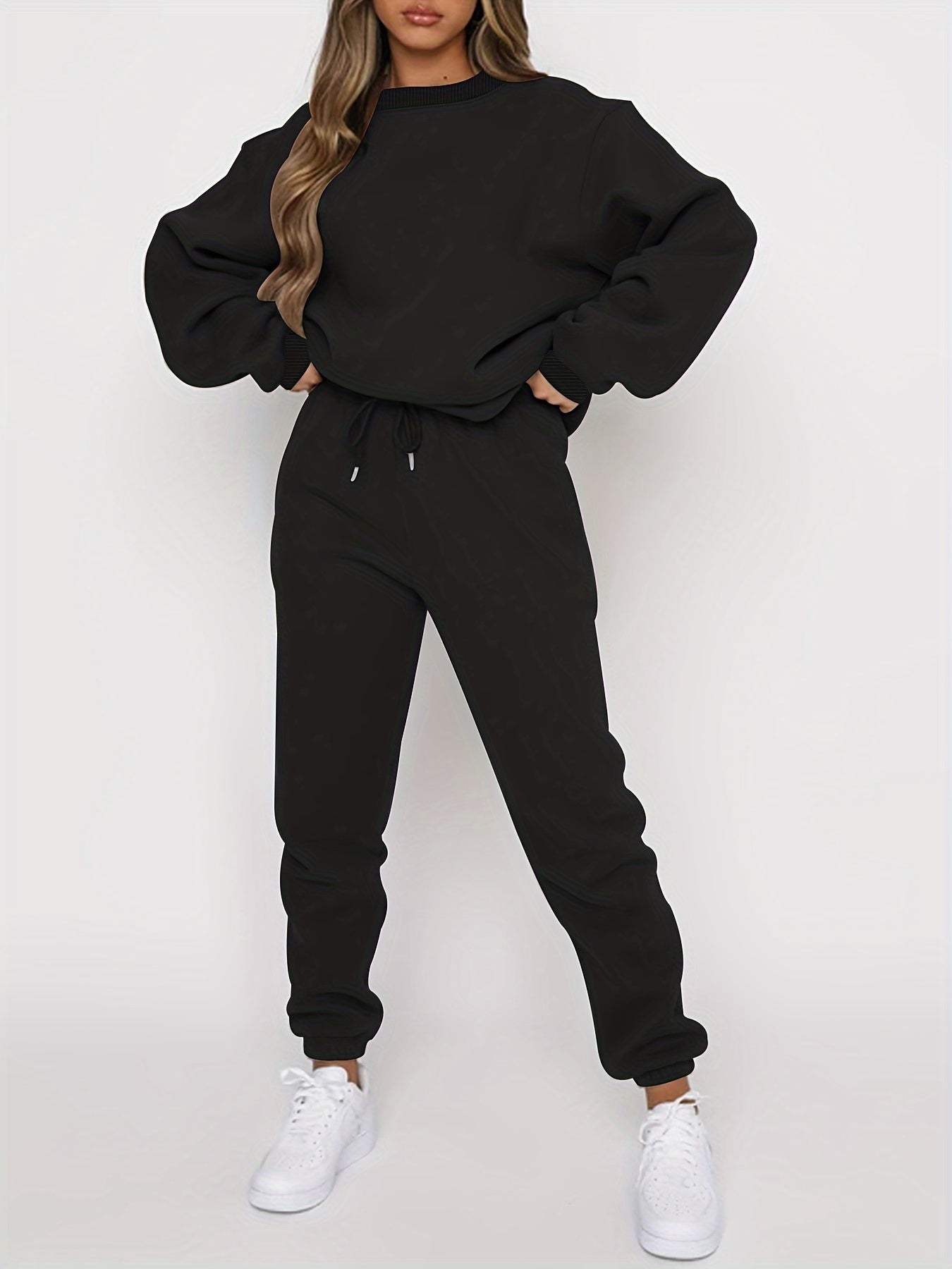Women's gray oversized sweatshirt and high-waisted jogger set with relaxed casual fit