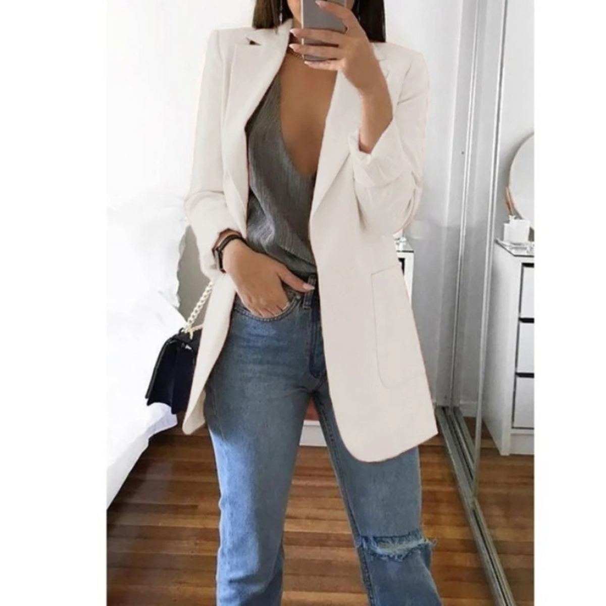 Women's structured single-breasted blazer with notched lapel and welt pockets, tailored fit