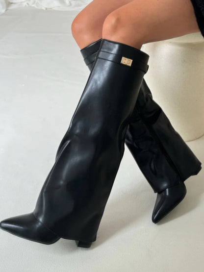 Women's black slouchy pointed-toe thigh-high boots with relaxed drape and leg-lengthening silhouette