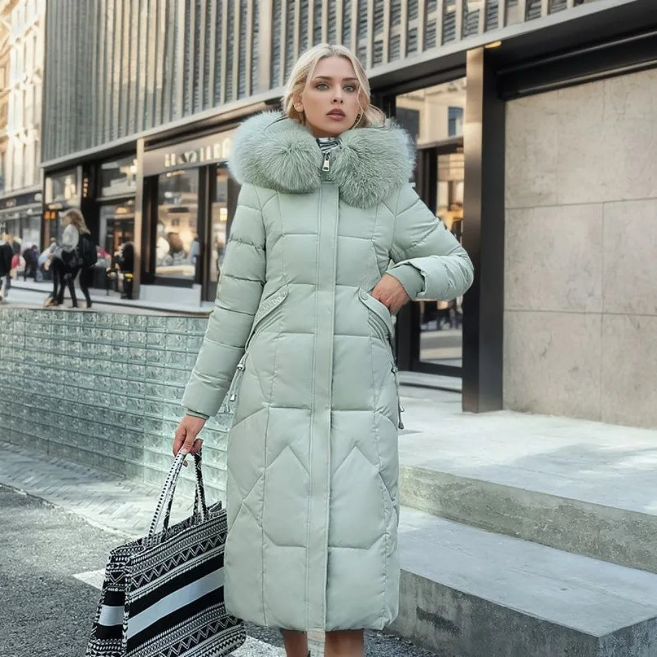 Women's long quilted winter coat with hood trim, cozy flattering silhouette in elegant cold-weather style