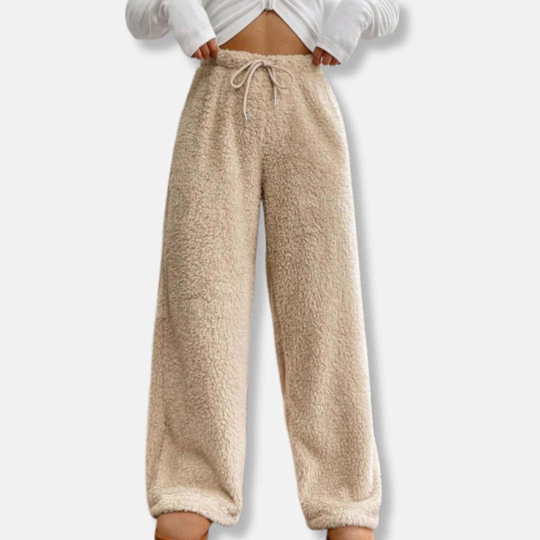 Women's plush fleece lounge pants in loose wide-leg fit with adjustable drawstring waist