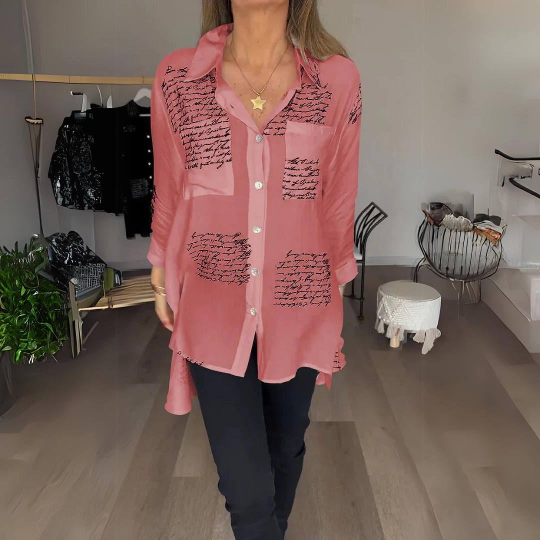 White relaxed button-up shirt with artistic handwritten script print, classic tailoring with bold personality
