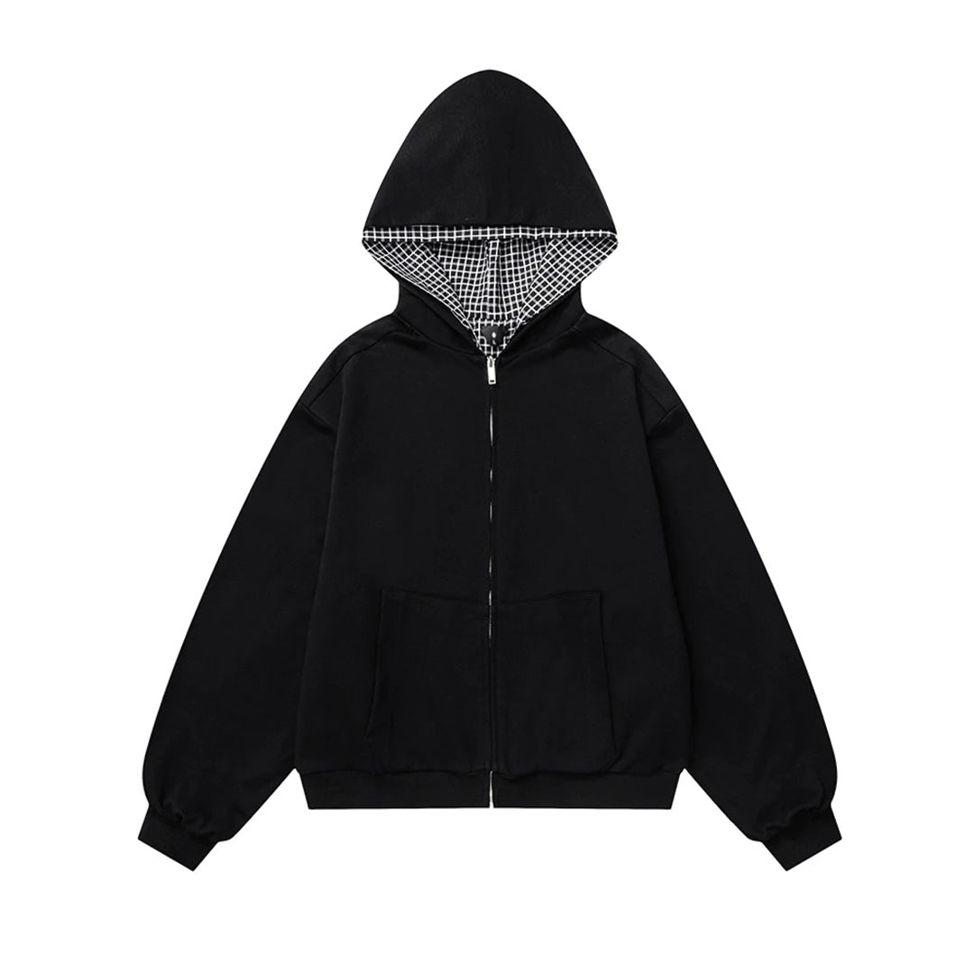 Black reversible zip-up hoodie with check-pattern lining, relaxed fit and full zipper closure