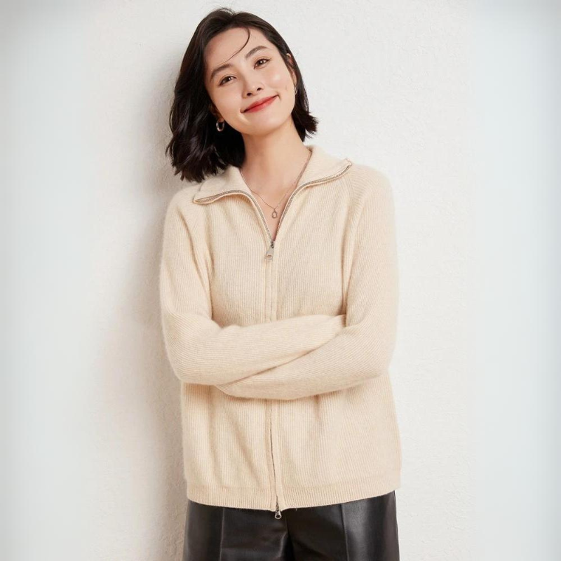 Merino wool zip-up sweater with turn-down collar, sleek zipper closure, timeless knit texture