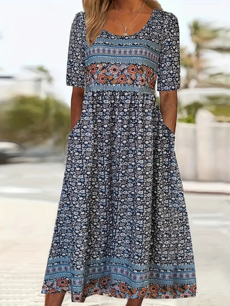 Bohemian print midi dress with round neckline, flowing relaxed silhouette in vibrant artistic pattern