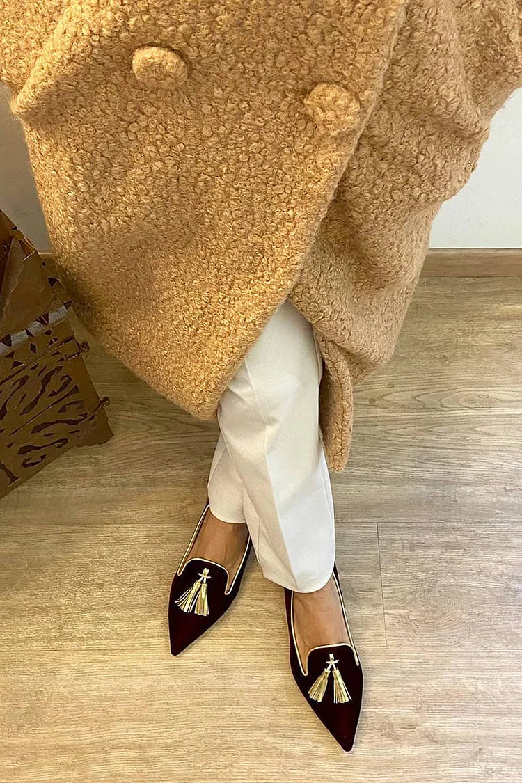 Polished tassel loafers in smooth finish, classic silhouette with charming tassel accents for timeless elegance