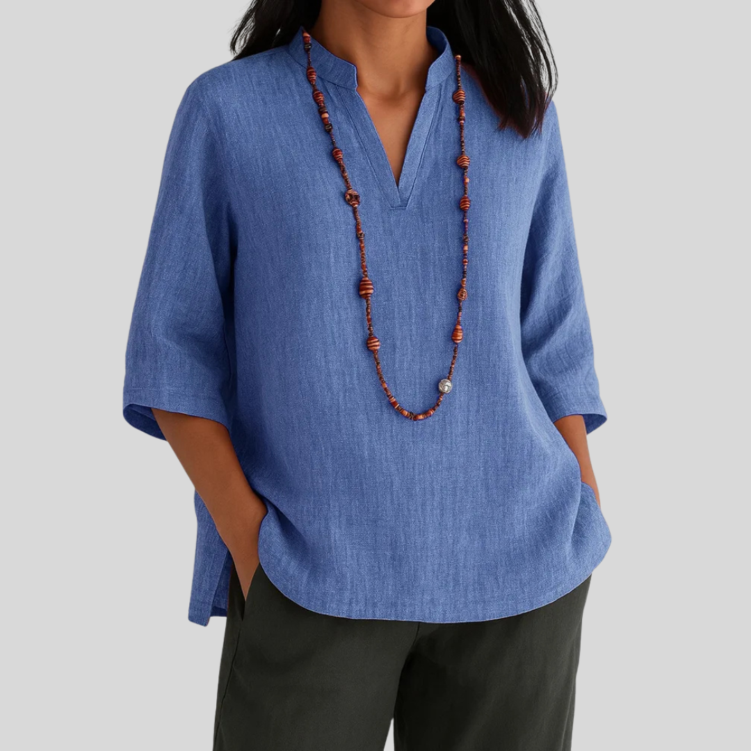 Soft green relaxed-fit blouse with airy drape and effortless elegant style for warm weather