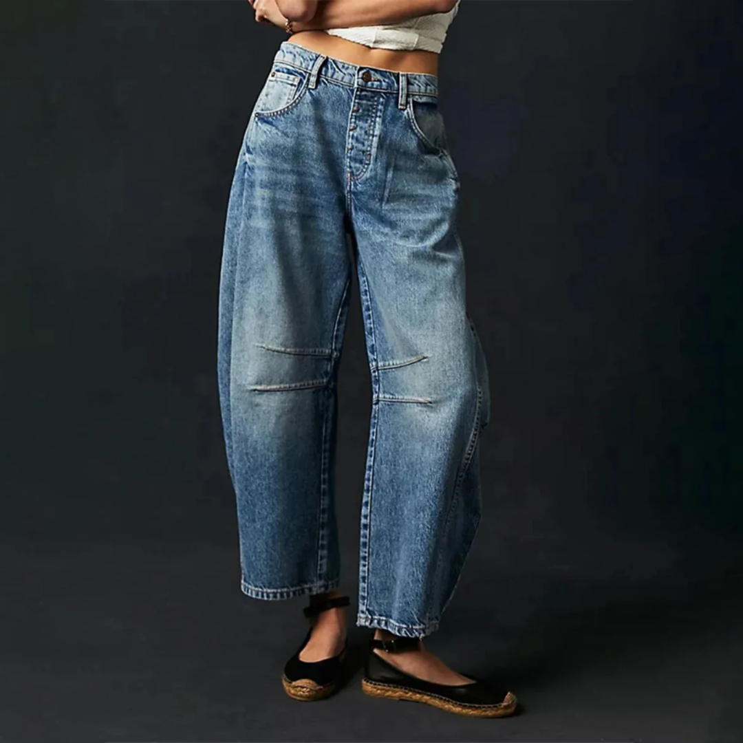 Women's high waist barrel leg jeans in light acid-wash denim with relaxed rounded silhouette