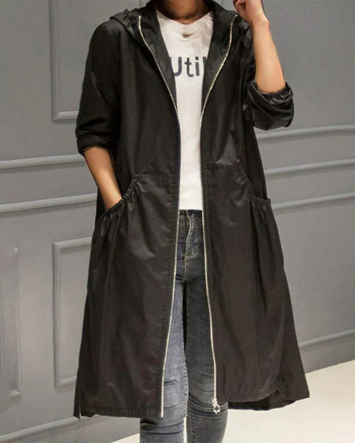 Women's knee-length relaxed fit hoodie with full zipper and front pockets, cozy outerwear
