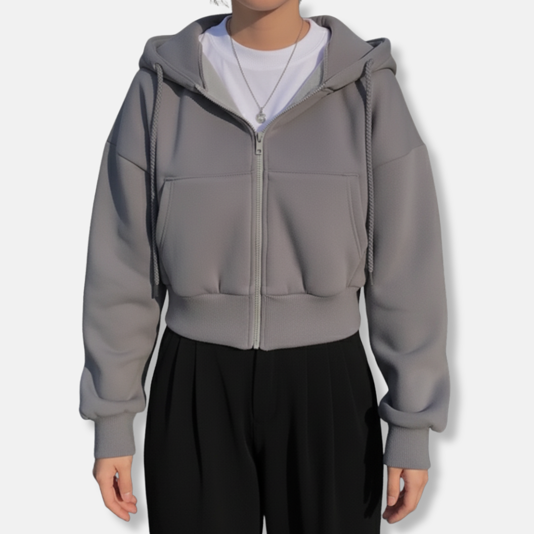 Women's oversized zip-up hoodie in neutral tone, fleece-lined with kangaroo pocket for cozy everyday style
