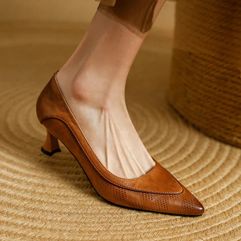 Women's pointed toe kitten heel pumps in neutral slip-on style with sculpted mid-height textured upper