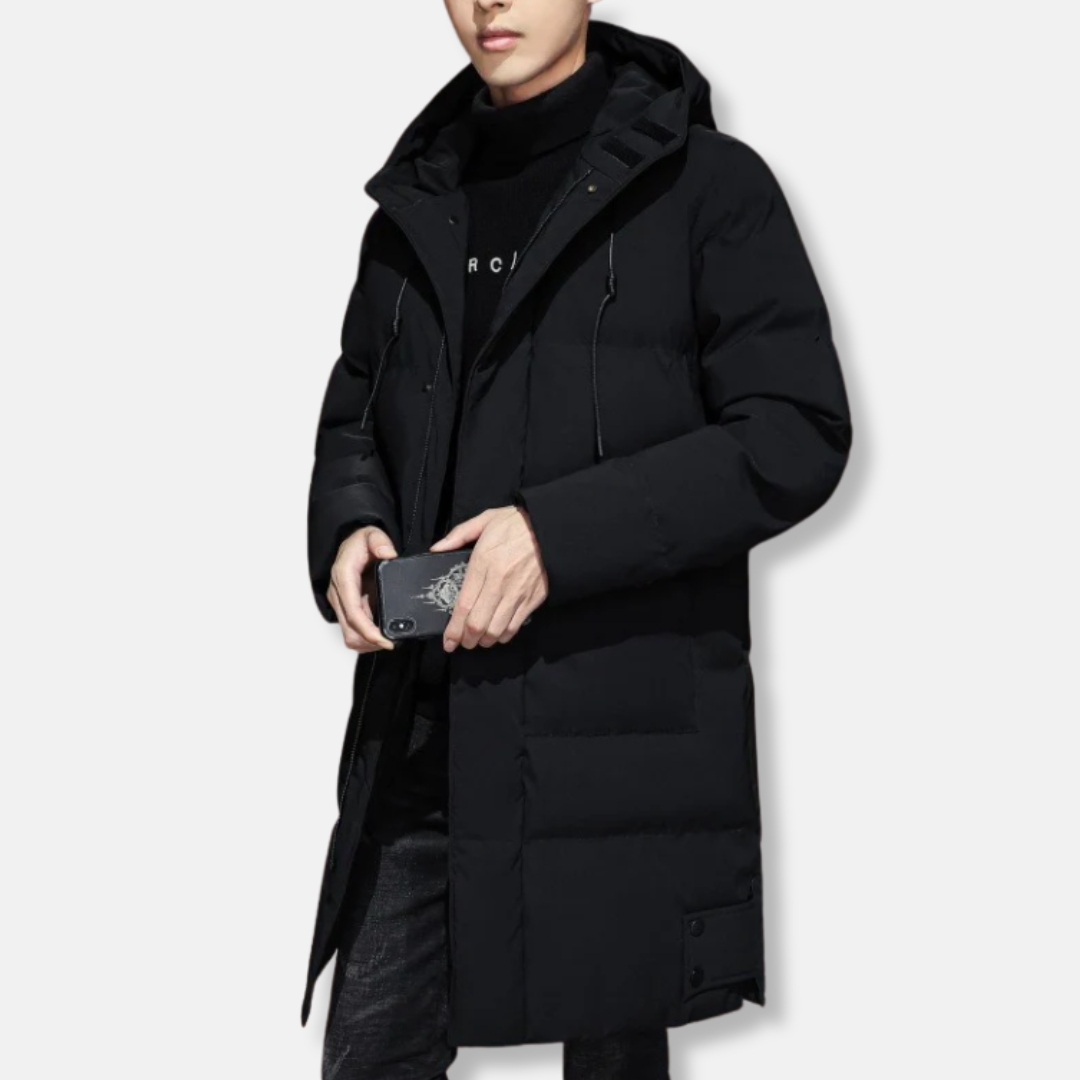 Men's long quilted hooded winter coat with zipper front, ribbed cuffs, and streamlined longline silhouette